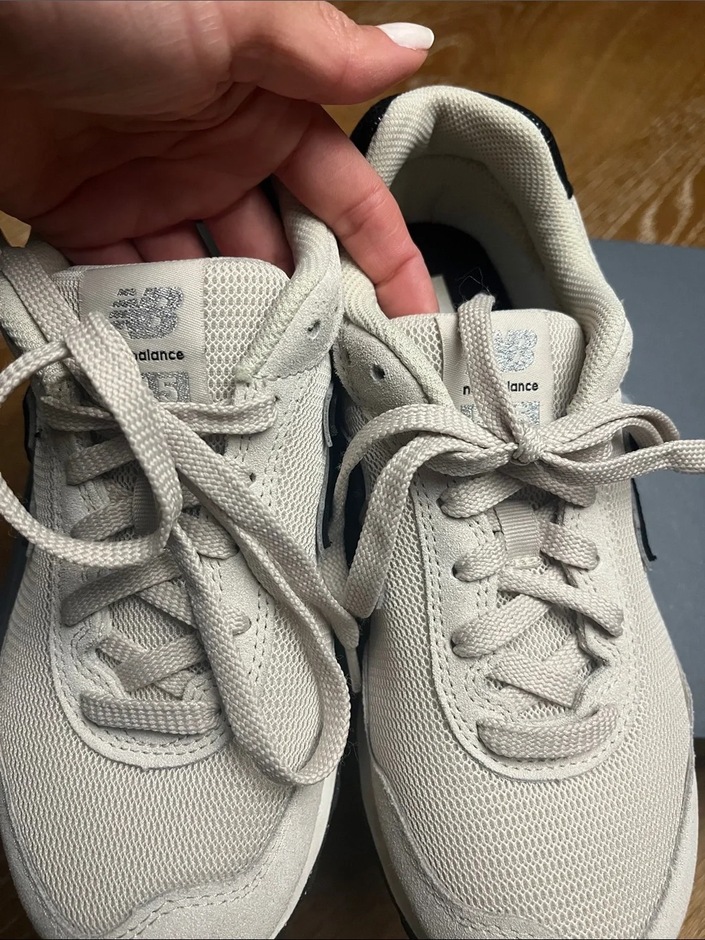 New Balance Woman’s  Cream Sneaker with dark navy blue 'N' Accent
